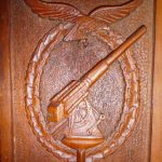 German PoW wood carving of anti-aircraft symbol (Henderson Homefront Collection)